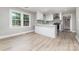 Modern eat-in kitchen with white cabinets, stainless steel appliances, and ample counter space at 3920 Admiral Ave, Charlotte, NC 28205
