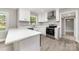 Modern kitchen with white cabinets, stainless steel appliances, and light-colored countertops at 3920 Admiral Ave, Charlotte, NC 28205