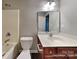 The bathroom has a vanity with sink, toilet and shower-tub combo at 4006 Lawrence Daniel Dr, Matthews, NC 28104