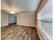 The spacious living room has wood-look flooring and plenty of natural light at 4006 Lawrence Daniel Dr, Matthews, NC 28104
