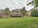 Exterior view of the home's spacious backyard with lush grass and mature landscaping at 410 Deer Brush Ln, Waxhaw, NC 28173