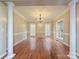 Formal dining room featuring hardwood floors, columns, and a chandelier at 410 Deer Brush Ln, Waxhaw, NC 28173