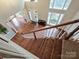 Foyer featuring hardwood floors, a bench, and lots of natural light from the large windows at 410 Deer Brush Ln, Waxhaw, NC 28173