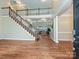 Bright foyer featuring hardwood floors and staircase to second level at 410 Deer Brush Ln, Waxhaw, NC 28173