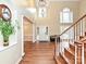 Open foyer featuring hardwood floors, high ceilings, and staircase to second level at 410 Deer Brush Ln, Waxhaw, NC 28173