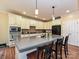 Eat-in kitchen featuring a center island, pendant lighting, granite counters, and modern appliances at 410 Deer Brush Ln, Waxhaw, NC 28173