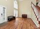 Spacious living room featuring hardwood floors, lots of natural light, and staircase at 410 Deer Brush Ln, Waxhaw, NC 28173