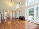 Spacious living room featuring hardwood floors, lots of natural light, and high ceilings at 410 Deer Brush Ln, Waxhaw, NC 28173