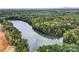 Breathtaking aerial view of a serene lake surrounded by lush trees at 4134 Eastover Glen Rd # 0319, Charlotte, NC 28269