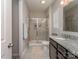 Modern bathroom featuring a granite countertop, and a glass-enclosed shower at 4205 Bent Green Ln, Monroe, NC 28112