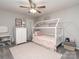 Charming bedroom with house-shaped bed, soft rug, and lovely decor at 4205 Bent Green Ln, Monroe, NC 28112
