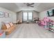 Large bonus room with ceiling fan, gray carpet, and plenty of space for play at 4205 Bent Green Ln, Monroe, NC 28112