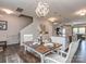 Open dining area with modern lighting and views of the kitchen and living spaces at 4205 Bent Green Ln, Monroe, NC 28112