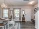 Inviting dining area with a wooden table, stylish decor, and ample natural light at 4205 Bent Green Ln, Monroe, NC 28112
