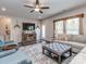 Comfortable living room featuring a ceiling fan, modern furniture, and hardwood floors at 4205 Bent Green Ln, Monroe, NC 28112