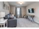 Cozy living room with gray couch, window and carpet at 4205 Bent Green Ln, Monroe, NC 28112