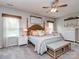 Comfortable main bedroom featuring a four-poster bed and lots of natural light at 4205 Bent Green Ln, Monroe, NC 28112
