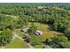Beautiful aerial view of the property, highlighting the house, barn, and lush green surroundings at 425 Troutman Rd, Rockwell, NC 28138