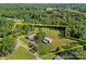 Expansive aerial view showcasing the property's boundaries, including the house, barn, and surrounding landscape at 425 Troutman Rd, Rockwell, NC 28138