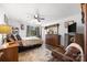 Spacious bedroom with ceiling fan, decorative rug, and wooden furniture at 425 Troutman Rd, Rockwell, NC 28138