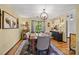 Cozy dining room with a wooden table, upholstered chairs, and decorative lighting at 425 Troutman Rd, Rockwell, NC 28138