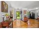Bright entryway featuring hardwood floors, decorative accents, and an open door view at 425 Troutman Rd, Rockwell, NC 28138