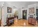 Charming entryway showcases hardwood floors, decorative table, and interior door at 425 Troutman Rd, Rockwell, NC 28138