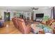 Comfortable living room features hardwood floors, ceiling fan, and an array of seating options at 425 Troutman Rd, Rockwell, NC 28138