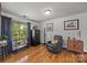 Cozy room with window view, hardwood floors, decor, and comfortable seating at 425 Troutman Rd, Rockwell, NC 28138