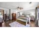 Spacious main bedroom offers a serene atmosphere with hardwood floors, neutral tones, and decorative furnishings at 425 Troutman Rd, Rockwell, NC 28138