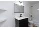Modern bathroom with a vanity, framed mirror, new lighting, and shower-tub combination at 4500 Ridgeley Dr, Charlotte, NC 28208