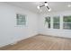 Bright bedroom with large windows and light wood flooring at 4500 Ridgeley Dr, Charlotte, NC 28208