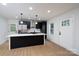 Bright kitchen with stainless steel appliances, white countertops, and black cabinetry at 4500 Ridgeley Dr, Charlotte, NC 28208