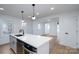 Open-concept kitchen with stainless steel appliances and a large island at 4500 Ridgeley Dr, Charlotte, NC 28208