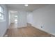 Bright living room features light hardwood flooring and neutral paint, enhancing its spacious feel at 4500 Ridgeley Dr, Charlotte, NC 28208