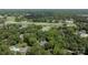 Aerial view of a stunning home nestled among lush greenery with a golf course in the background at 4920 Parview S Dr, Charlotte, NC 28226