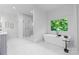 Bright bathroom showcasing a freestanding tub, glass shower, and modern fixtures at 4920 Parview S Dr, Charlotte, NC 28226