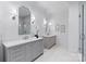 Elegant bathroom with dual vanities, framed mirrors, and modern fixtures at 4920 Parview S Dr, Charlotte, NC 28226