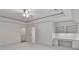 Spacious bedroom with custom built-in desk and ceiling fan at 4920 Parview S Dr, Charlotte, NC 28226