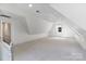 Bright bonus room with neutral color palette, carpet flooring, dormer window, and recessed lighting at 4920 Parview S Dr, Charlotte, NC 28226