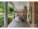 Spacious front porch with rocking chairs, offering a comfortable and relaxing outdoor space at 4920 Parview S Dr, Charlotte, NC 28226