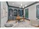 Elegant home office with custom built-in shelving, a stylish desk, and abundant natural light at 4920 Parview S Dr, Charlotte, NC 28226