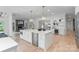 Bright kitchen featuring a central island with marble countertop, stainless steel appliances, and pendant lighting at 4920 Parview S Dr, Charlotte, NC 28226