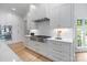 Contemporary kitchen featuring stainless appliances, quartz countertops, custom cabinets and gas cooktop at 4920 Parview S Dr, Charlotte, NC 28226