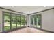 Sun-drenched living room with large windows that bring in tons of natural light and provide views of the trees at 4920 Parview S Dr, Charlotte, NC 28226