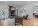 Cozy living room with stone fireplace, hardwood floors, and contemporary decor, creating a warm and inviting atmosphere at 4920 Parview S Dr, Charlotte, NC 28226