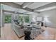 Bright and airy living room featuring large windows, a cozy fireplace, and stylish furnishings for a welcoming space at 4920 Parview S Dr, Charlotte, NC 28226
