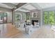 Elegant living room with coffered ceilings, fireplace, and oversized windows showcasing natural light and modern furnishings at 4920 Parview S Dr, Charlotte, NC 28226