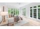 Sun-filled main bedroom with large windows and plush bedding at 4920 Parview S Dr, Charlotte, NC 28226