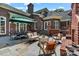 Outdoor patio with a full kitchen, seating area, and lush landscaping, ideal for entertaining and relaxing at 4920 Parview S Dr, Charlotte, NC 28226